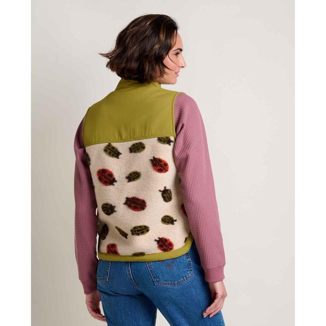 Back view of the Toad & Co Women's Sespe Sherpa Vest in Barley Ladybugs on a model wearing blue jeans against a light background.