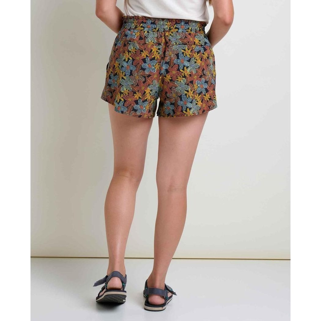 Back view of the Toad & Co Women's Sunkissed Pull-On Short in Almond Pattern Texture, showing the model wearing it and a plain white background.