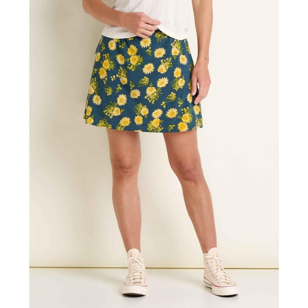 A front view of the Toad & Co Women's Sunkissed Weekend Skort in Midnight Print on a model wearing white sneakers against a plain background.