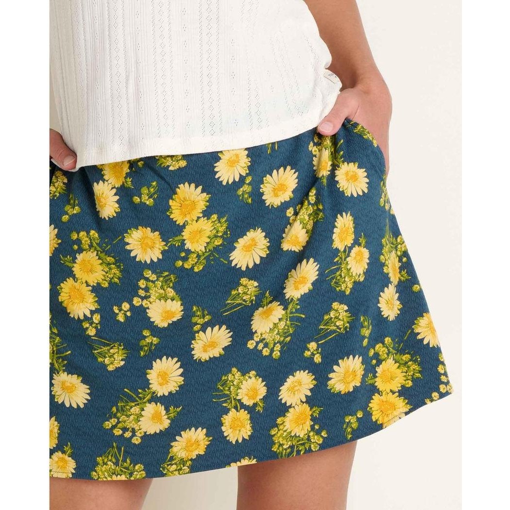 Midnight Print Toad & Co Women's Sunkissed Weekend Skort shown on a model with white top and hands in pockets against a plain background.