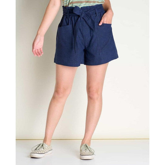 A front view of the Toad & Co Women's Tarn Short in True Navy on a model wearing sneakers against a plain background.