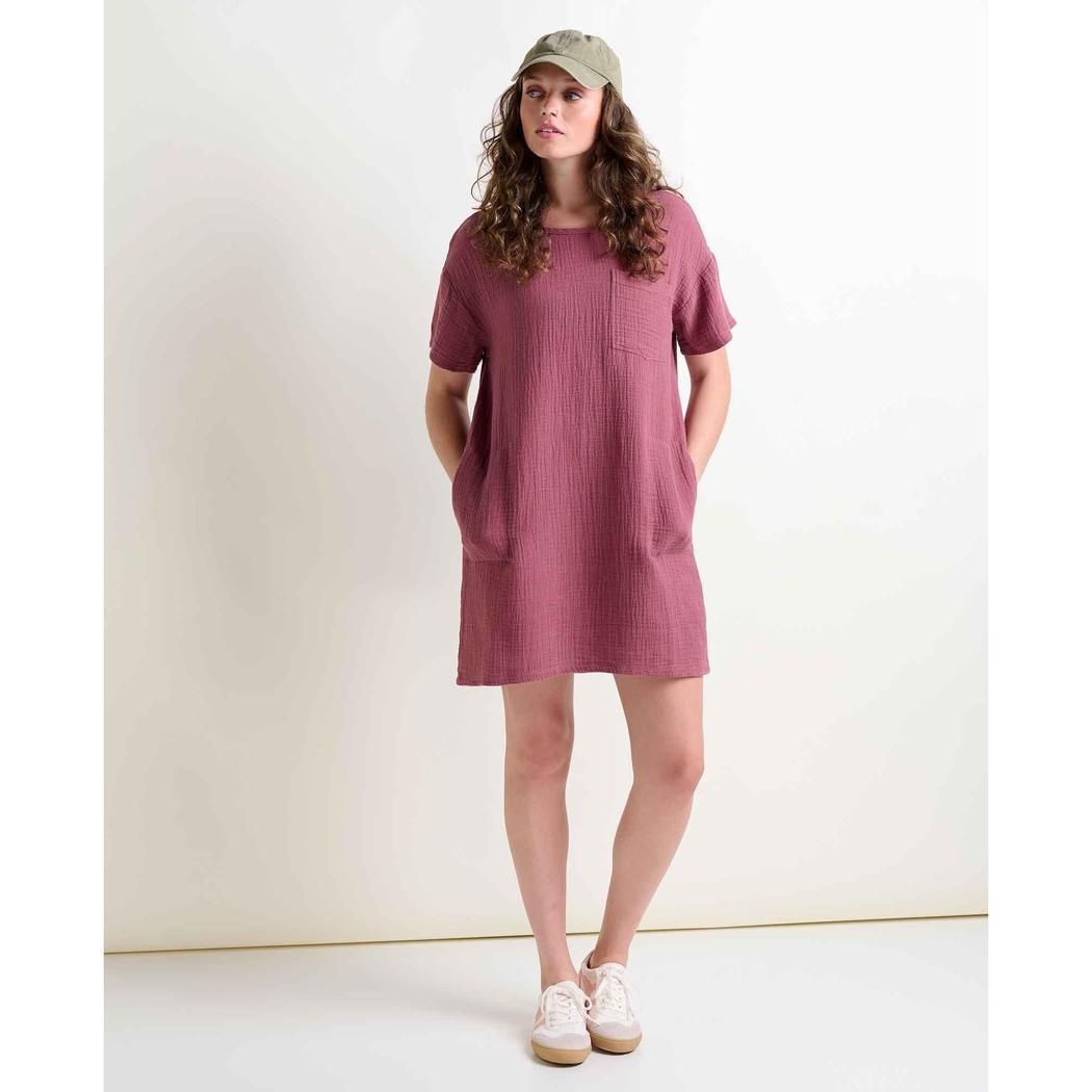A woman wearing the Toad & Co Women's Tate Double Weave Short Sleeve Dress in Wild Ginger stands against a plain white background.