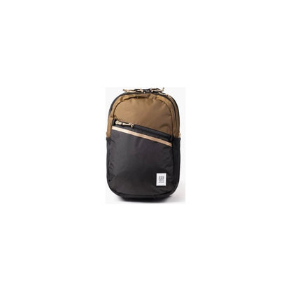 A front view of the Topo Designs Commuter Backpack in Beetle/Khaki with a diagonal zip pocket and a small logo patch, set against a plain white background.