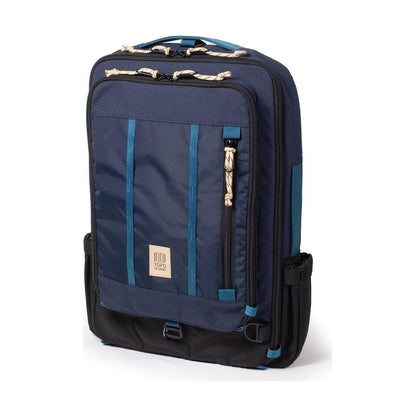 A front view of the Topo Designs Global Travel Bag 30L in Navy / Sahara with a zippered pocket and blue accents against a white background.