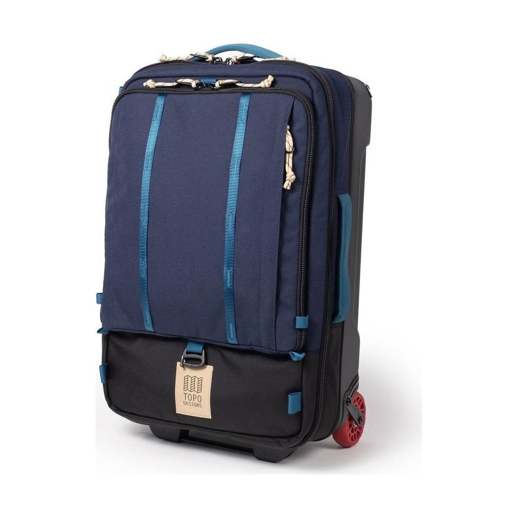 A front view of the Topo Designs Global Travel Bag Roller in Navy/Sahara with red wheels and a black bottom section.