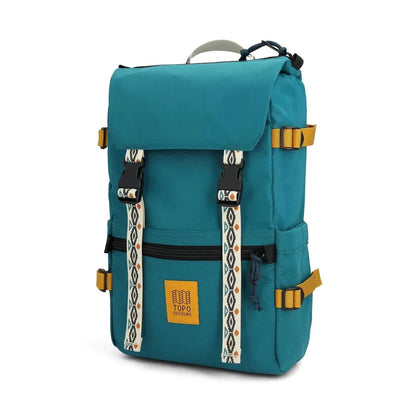 A front view of the Topo Designs Rover Pack Classic in Black/Neutral with yellow buckles and a front zip pocket against a white background.