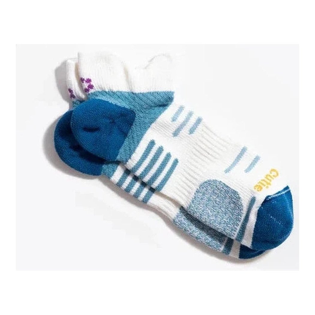 A close-up of the Tough Cuties Tia - Ladies All Terrain Performance No Show Tab socks in White Blue Haze, showing the toe and heel padding against a white background.