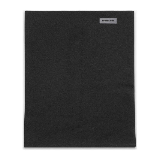 A black Turtle Fur Carefree Merino Wool Pipe Dream bandana shown from the front with a small logo tag visible.