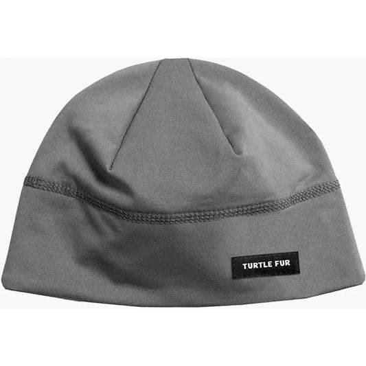 A front view of the Turtle Fur Comfort Shell Brain Shroud in Black showing the label and stitching against a white background.