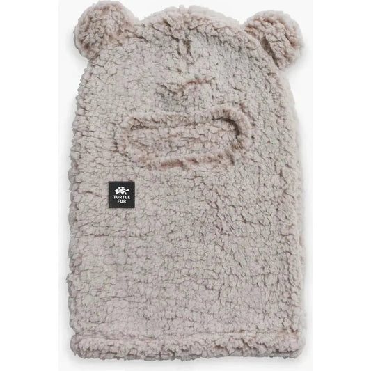Natural Turtle Fur Kids Comfort Lush Bear Balaclava with bear ears and a black logo patch, shown from front against white background.
