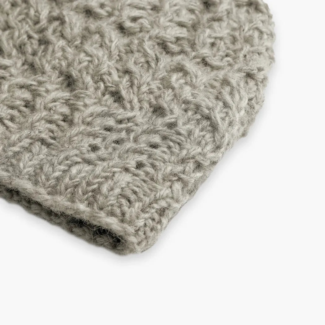 A close-up of the Turtle Fur Nepal Handmade Wool Mika hat in Black, showing the textured knit and folded brim against a white background.