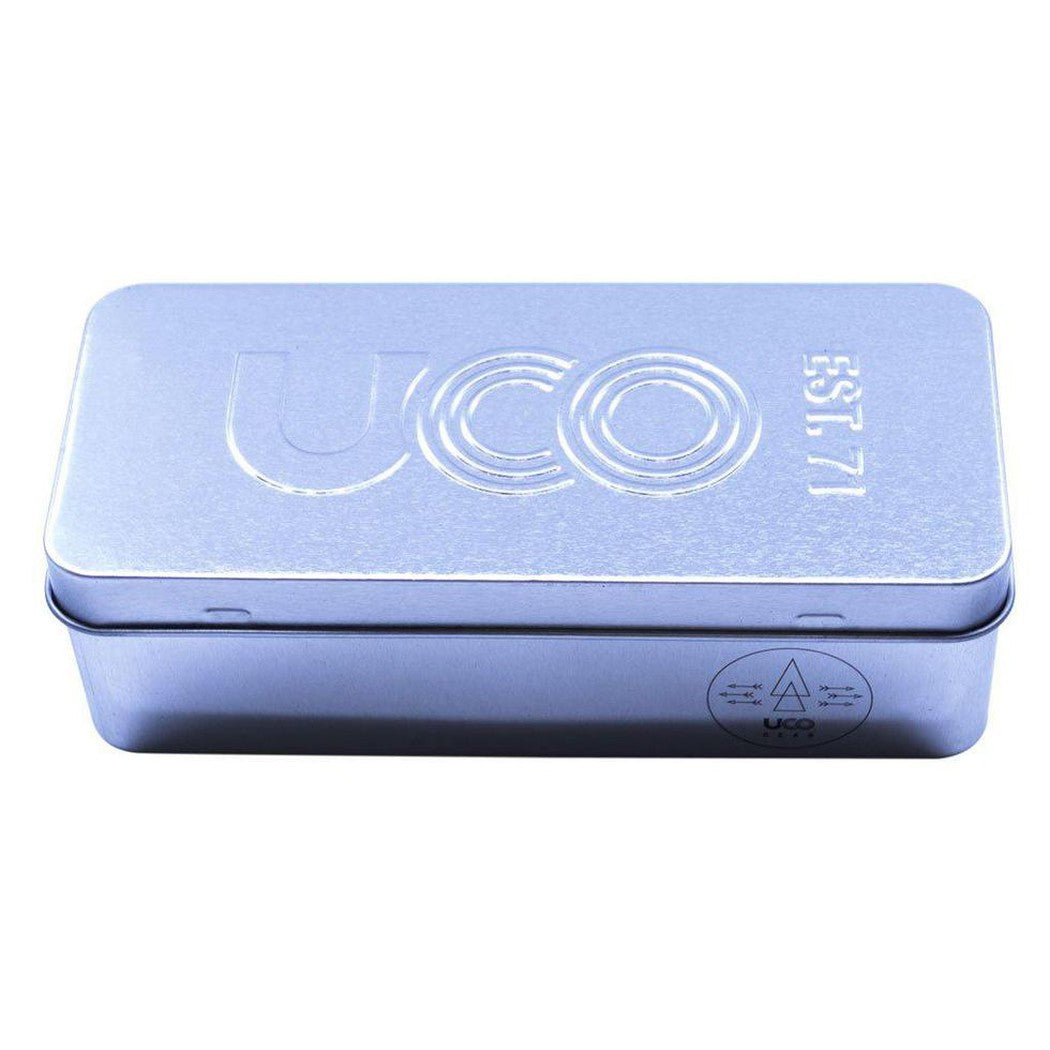 A top-down view of the UCO Behemoth Sweetfire Match Kit in a light blue tin with "EST. 71" embossed on the lid.