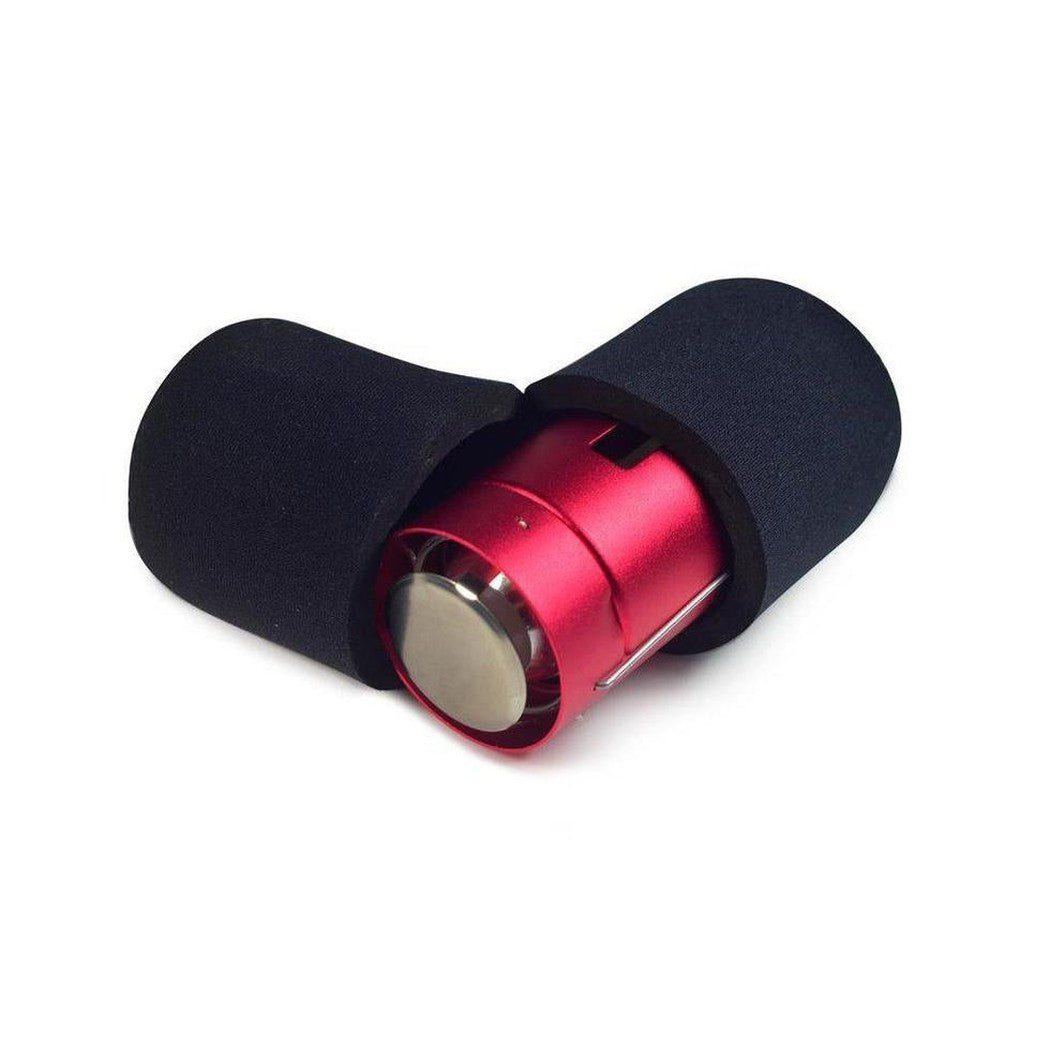 A side view of the UCO Neoprene Cocoon - Original Candle Lantern in Charcoal/Graphite with a red lantern inside against a white background.