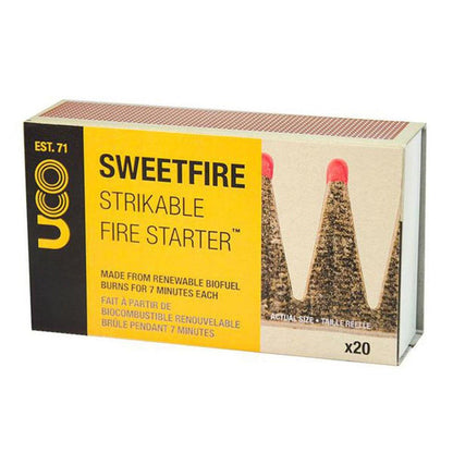 A box of UCO Sweetfire Strikeable Fire Starters showing the product name and description on a yellow label.