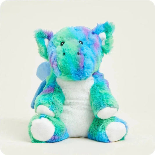 A front view of the Warmies Baby Dragon showing its white belly and blue wings against a plain white background.