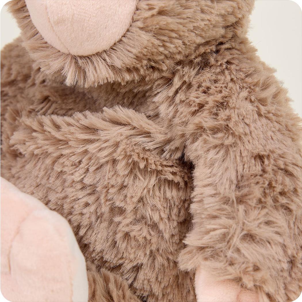 Close-up of the Warmies BigFoot showing its soft, fuzzy texture and light pink nose.