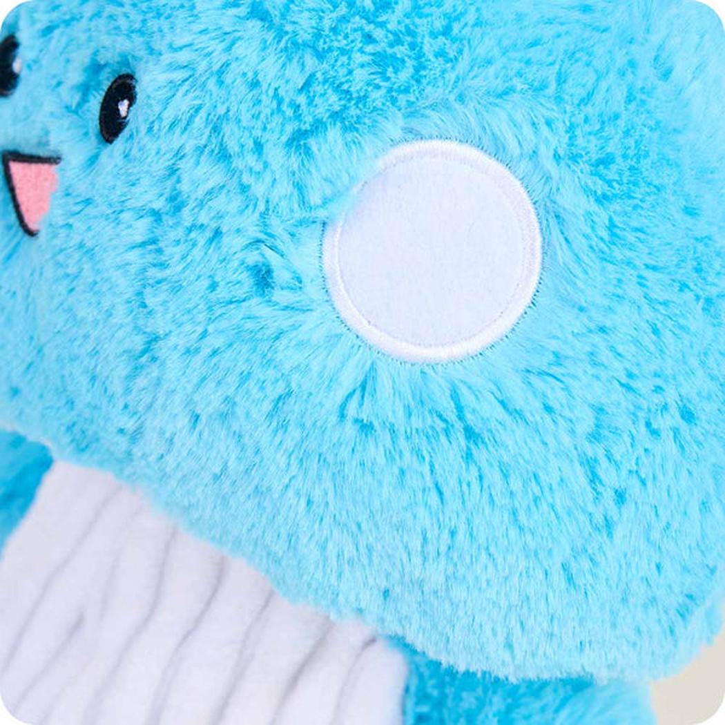 Close-up of the Warmies Blue Mushroom showing the soft blue fur and white circular patch.
