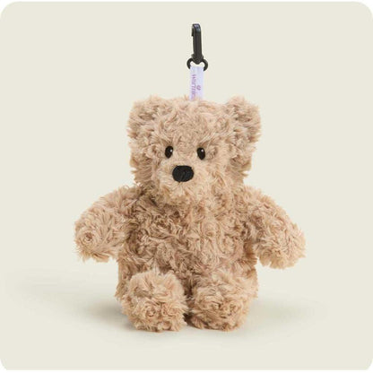 A close-up of the Warmies Brown Curly Bear Bag Charm hanging from a black carabiner against a plain white background.