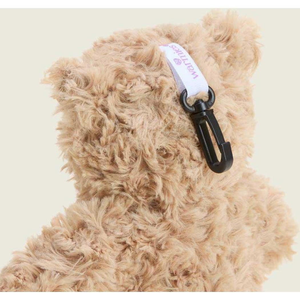 Back view of the Warmies Brown Curly Bear Bag Charm with a black carabiner and white tag against a light background.