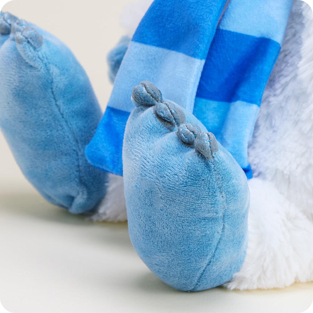 Close-up of the Warmies Bumble With Scarf showing its blue feet and striped scarf against a white background.