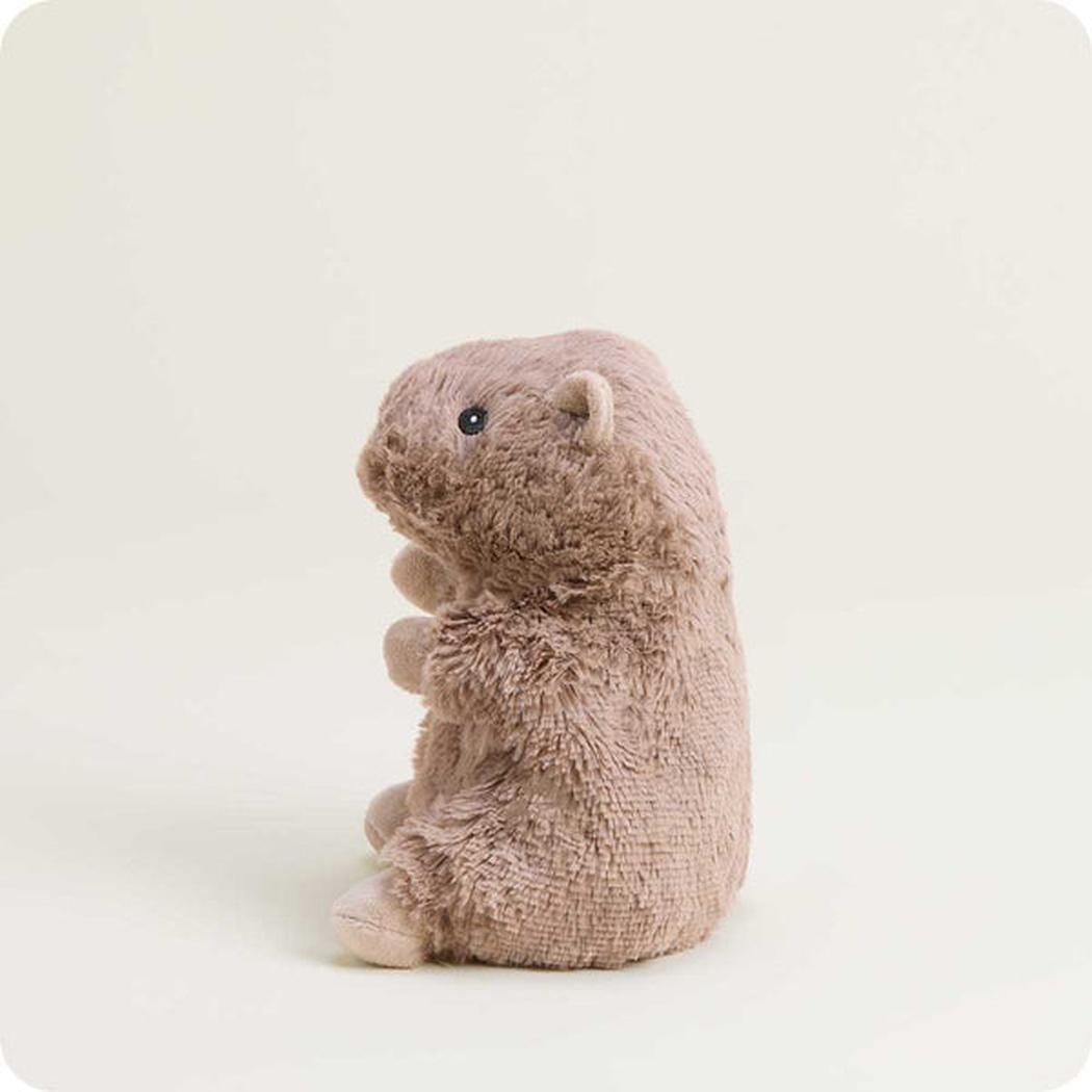 A side view of the Warmies Capybara Junior plush toy against a plain white background.