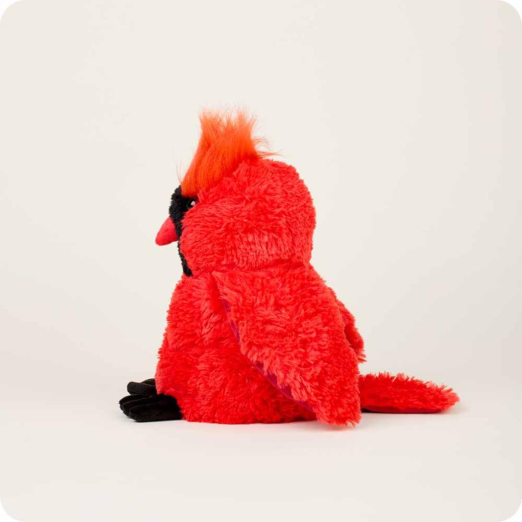 Side view of the Warmies Cardinal plush toy with bright orange crest and black beak against a plain white background.