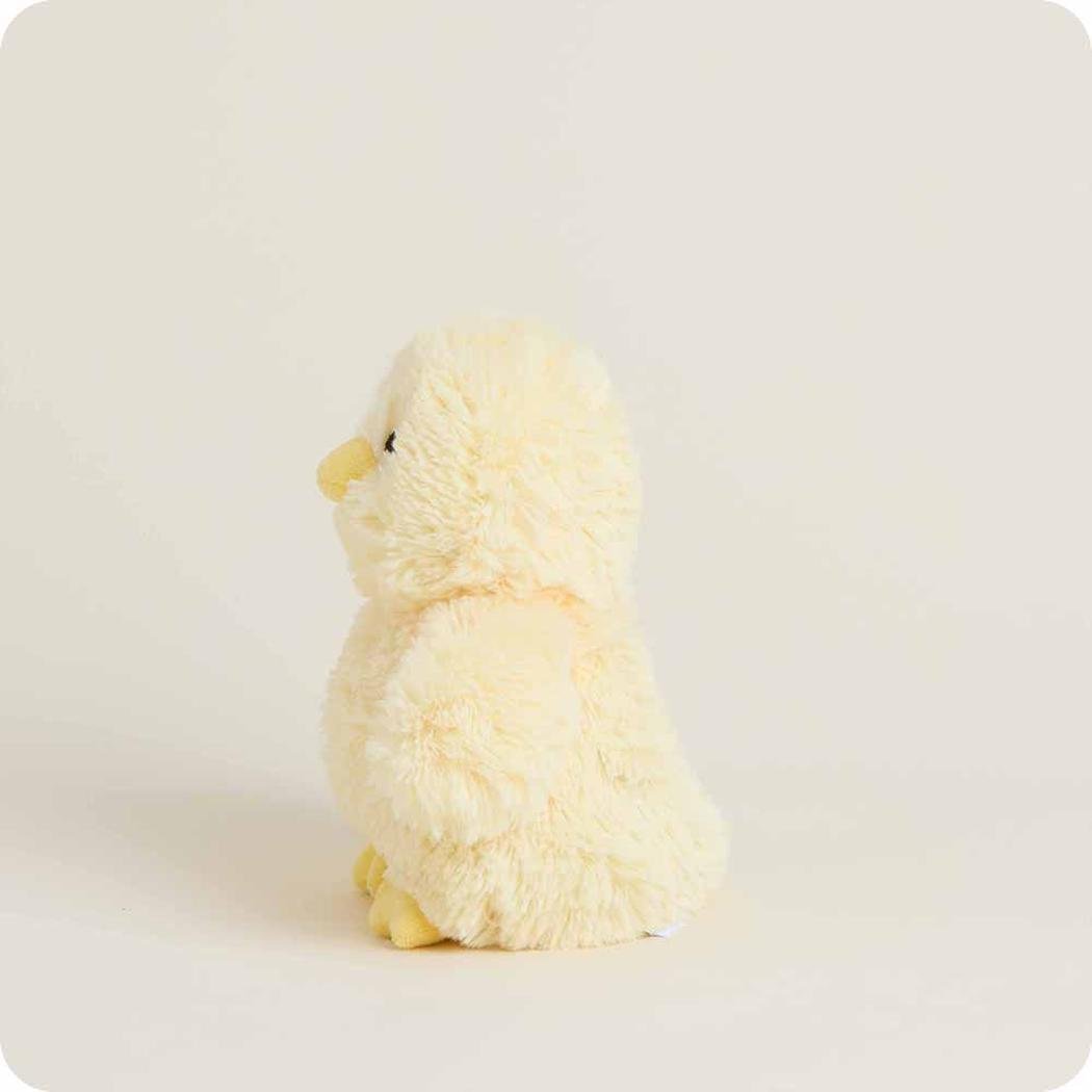 Side view of the Warmies Chick Warmies Junior plush toy against a plain white background.