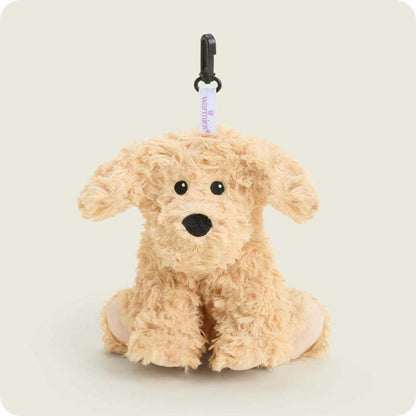 A front view of the Warmies Curly Dog Bag Charm with a black clip and white tag against a light background.