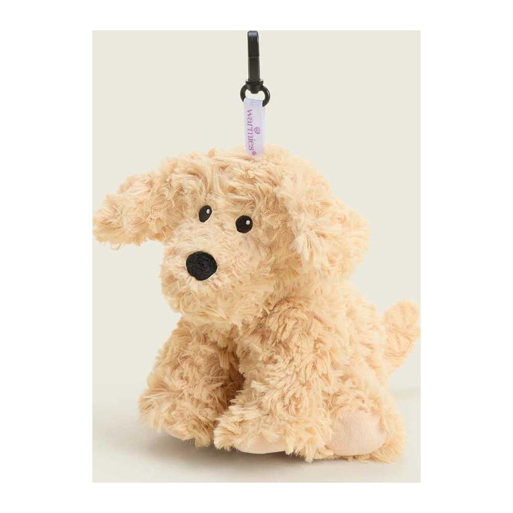 A front view of the Warmies Curly Dog Bag Charm with a black clip and white tag against a light background.