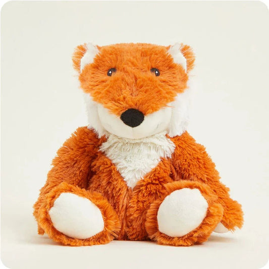A front view of the Warmies Fox plush toy with white paws and chest against a plain white background.