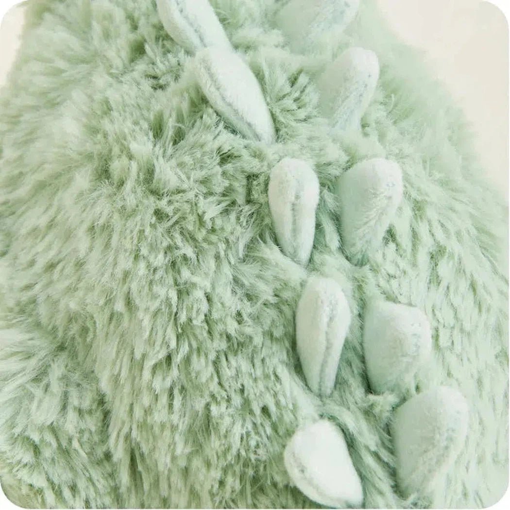 Close-up of the Warmies Green Long Neck Dinosaur showing its soft fur and stitched back spikes.