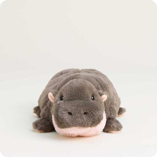A front-facing view of the Warmies Hippo plush toy with a soft, light background.