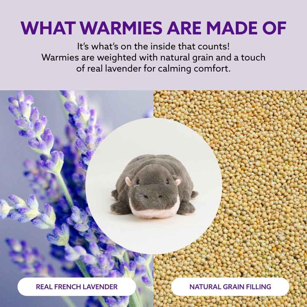 A Warmies Hippo plush toy sits in a circle between lavender and natural grain filling.