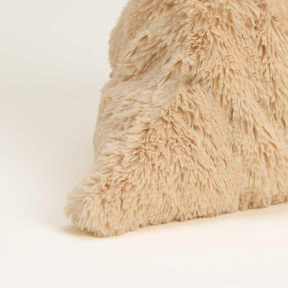 A close-up of the Warmies Megalosaurus plush toy showing its soft, fuzzy texture against a plain white background.