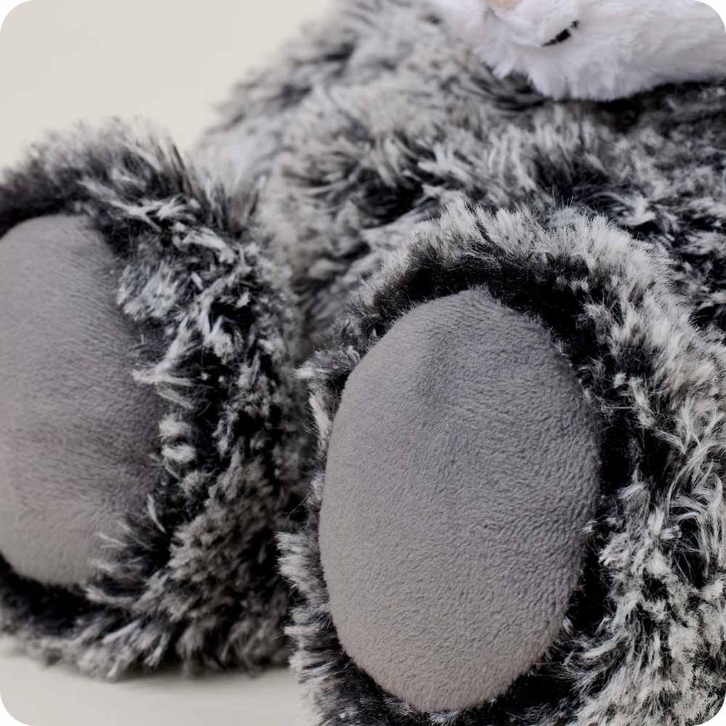 Close-up of the Warmies Opossum showing its fuzzy paw pads and soft fur texture.