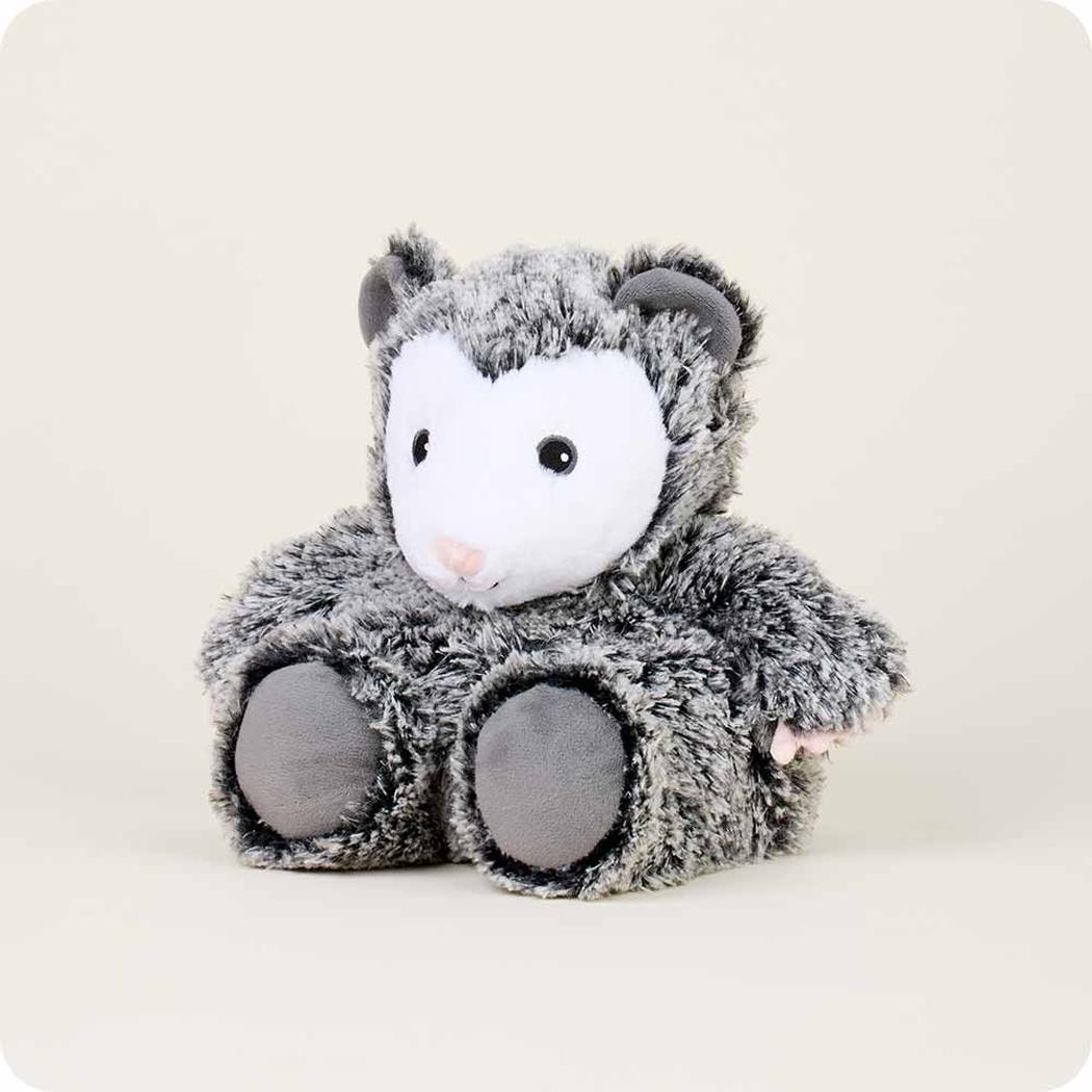 A front view of the Warmies Opossum plush toy with a soft, fuzzy texture and gray fur, sitting against a plain light background.