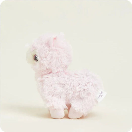 A side view of the Warmies Pink Llama Junior plush toy against a light background.