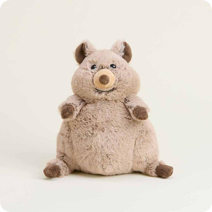 A front-facing view of the Warmies Quokka plush toy with a soft, light brown fur texture and brown accents on its nose, paws, and ears, sitting against a plain white background.