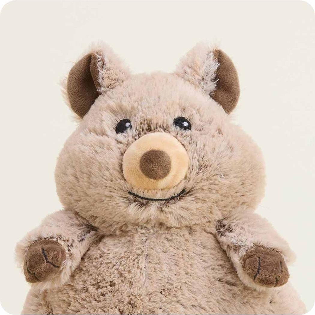 A front view of the Warmies Quokka plush toy with a light brown body and dark brown ears and paws against a plain white background.