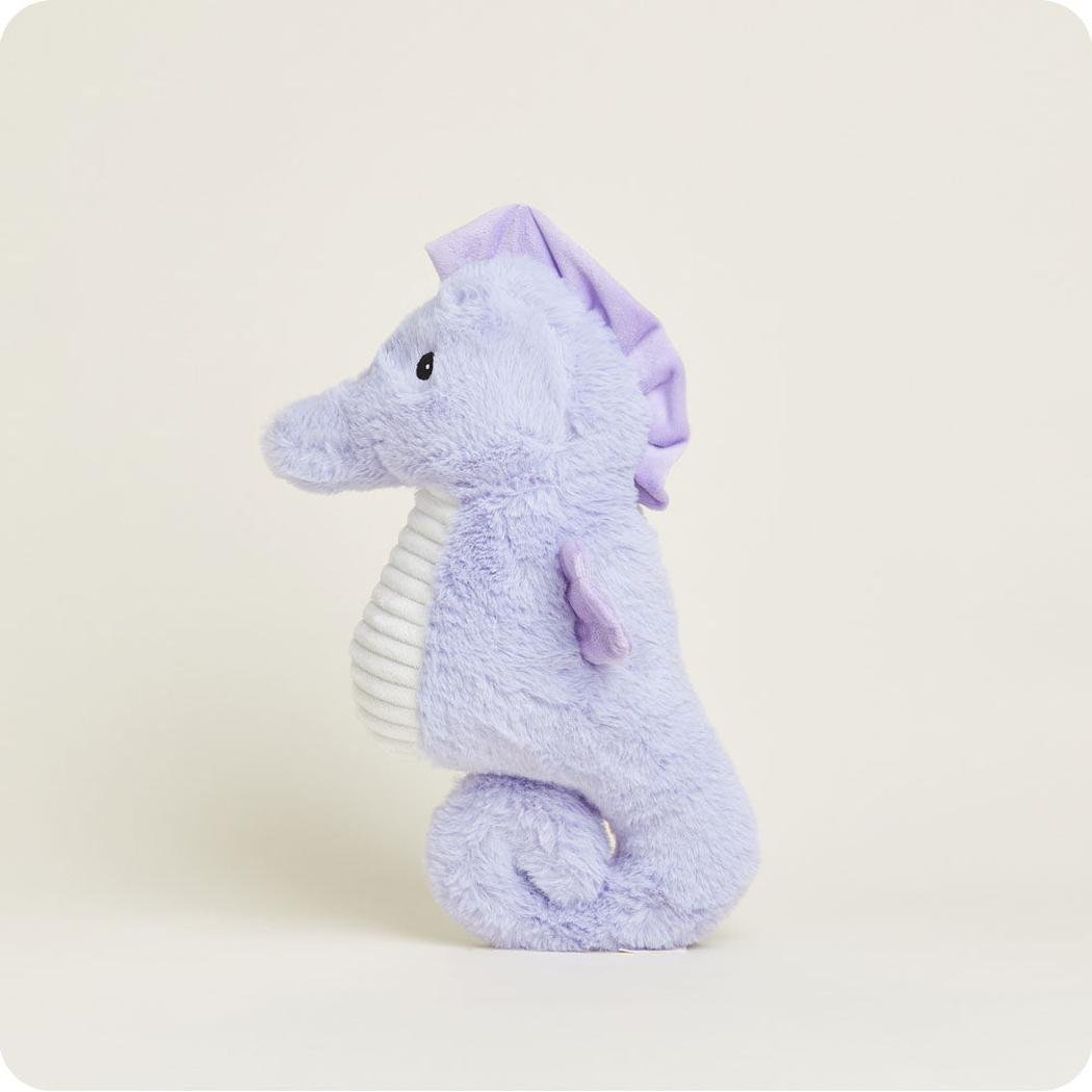 Side view of the Warmies Seahorse plush toy with a white ribbed belly against a plain background.