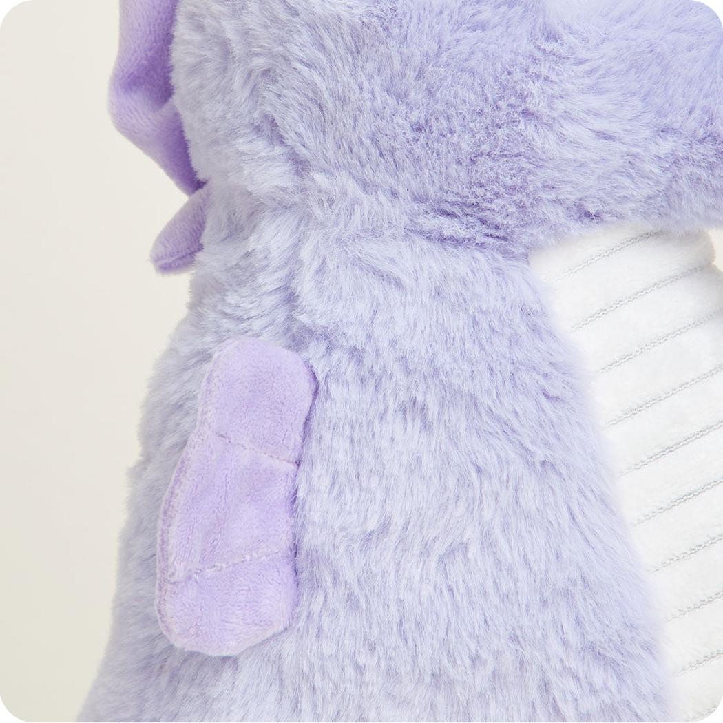 A close-up of the Warmies Seahorse showing its purple plush body and white ribbed tail against a plain background.