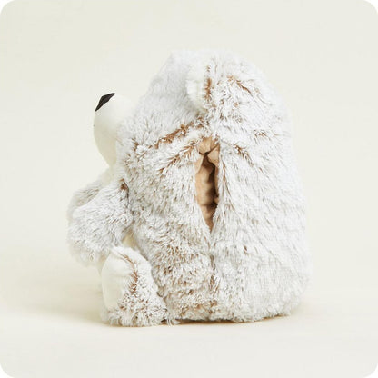 Back view of the Warmies Supersized Bear showing its plush texture and zipper closure against a light background.