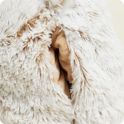 A close-up of the Warmies Supersized Bear shows a hand peeking out from its soft, white fur.