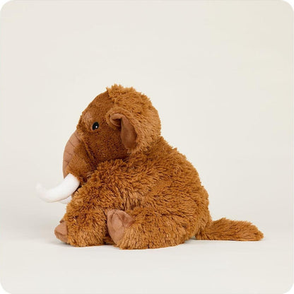 A front view of the Warmies Wooly Mammoth stuffed animal with white tusks against a plain white background.