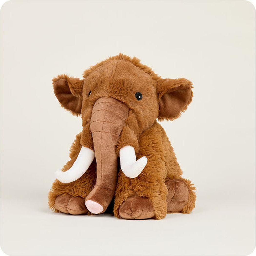 A front view of the Warmies Wooly Mammoth plush toy with white tusks against a plain white background.