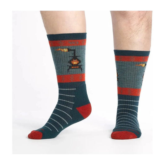 Side view of the Wide Open Men's Stoked Midweight Sock in Juniper showing the stove graphic and red toe against a white background.