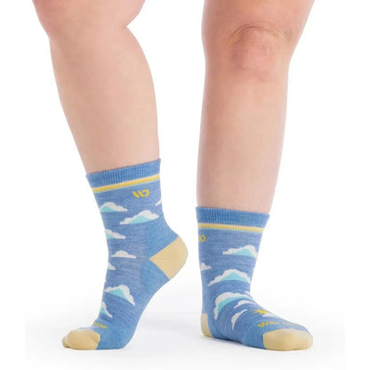 Side view of the Wide Open Women's Cloud Hopper Midweight Micro Crew Sock in Sky showing the cloud pattern and yellow toe against a white background.
