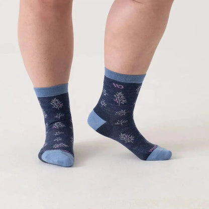 Side view of the Wide Open Women's Foliage Lightweight Micro Crew Sock in Denim showing the pattern and light blue heel and toe against a white background.