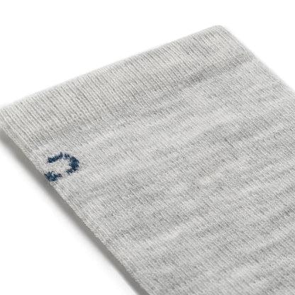 A close-up of the Wide Open Women's Solid Basic Crew Lightweight No Cushion Socks in Ash, showing the ribbed cuff and a small logo on the side against a white background.