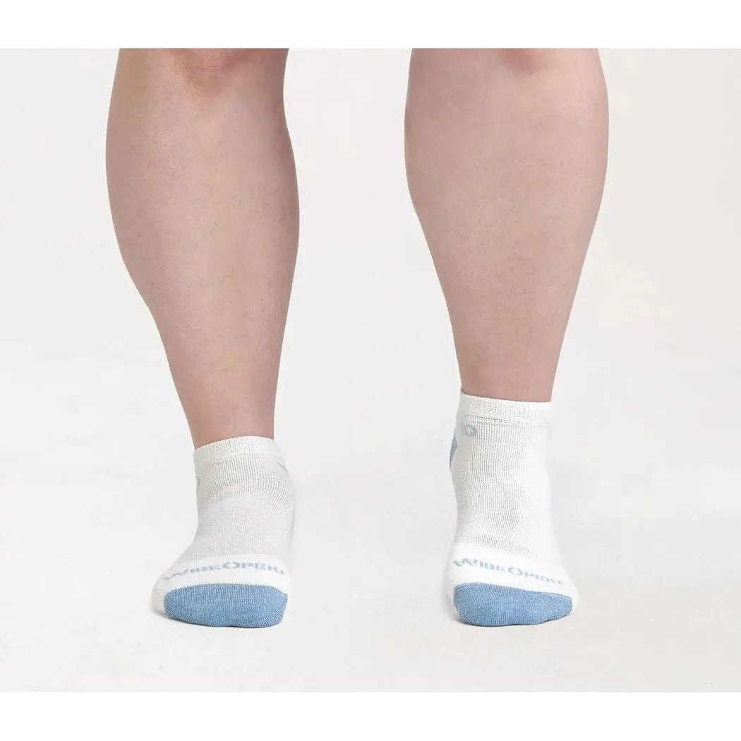 A front view of the Wide Open Women's Solid Midweight No Show Sock in Charcoal on a model against a white background.